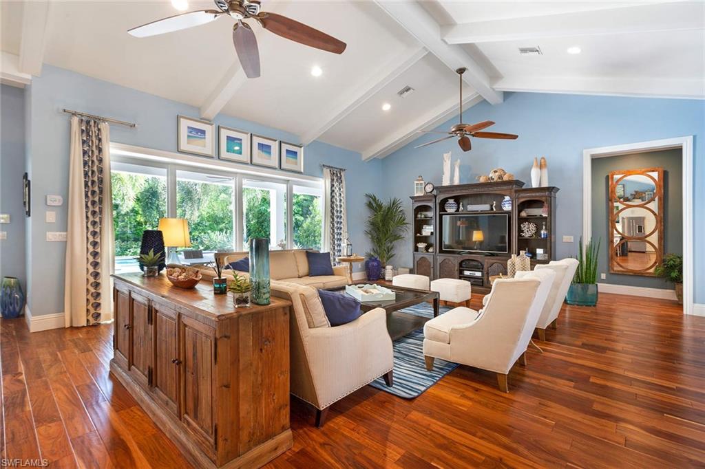 150 Central Avenue Naples, FL 34102 - Photo 5 of 35 a living room with furniture and a large window