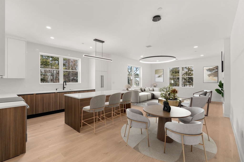 16 Stearns Road, Unit 106 Wellesley, MA 02482 - Photo 11 of 12 a living room with furniture a window and a table