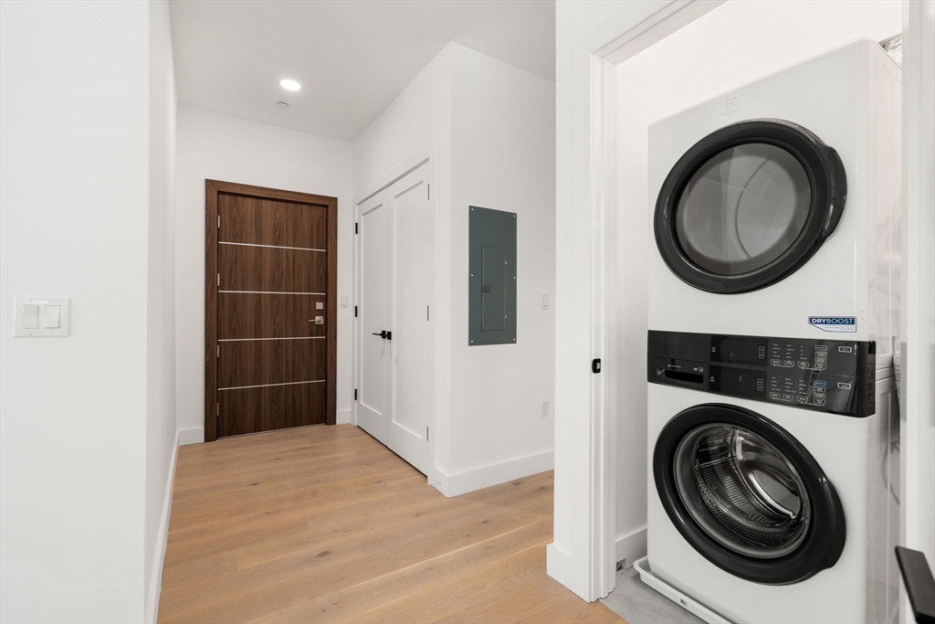 16 Stearns Road, Unit 106 Wellesley, MA 02482 - Photo 12 of 12 a view of a storage & utility room with washer and dryer