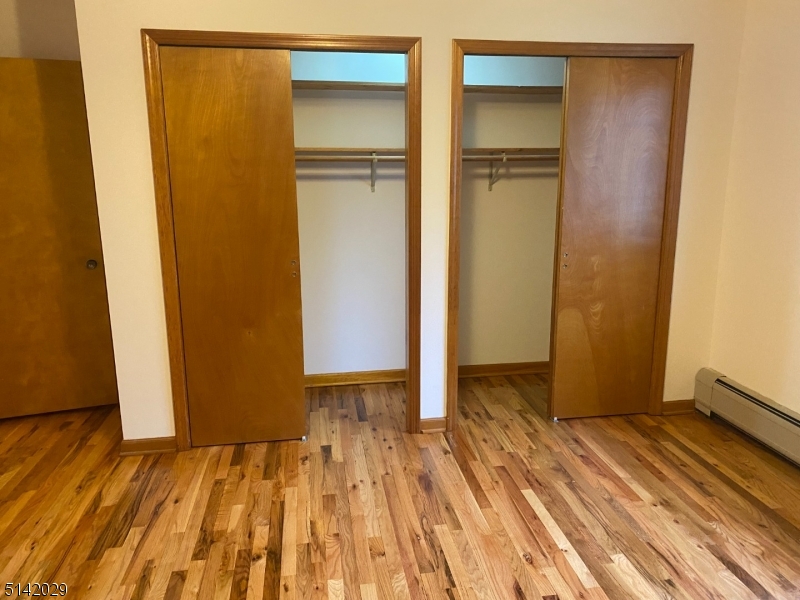 141 Prospect Street Nutley, NJ 07110 - Photo 11 of 18 a view of a room with wooden floor and a bathroom