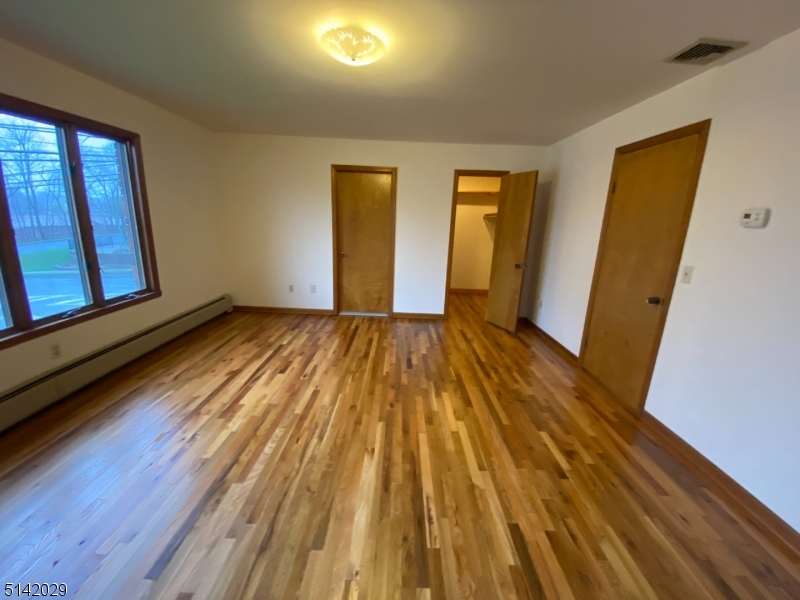 141 Prospect Street Nutley, NJ 07110 - Photo 17 of 18 a view of an empty room with wooden floor and a window