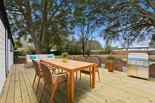 a patio with table and chairs
