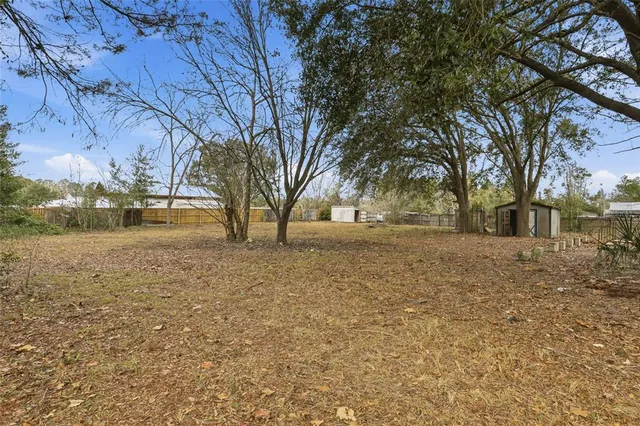 a view of open space with yard