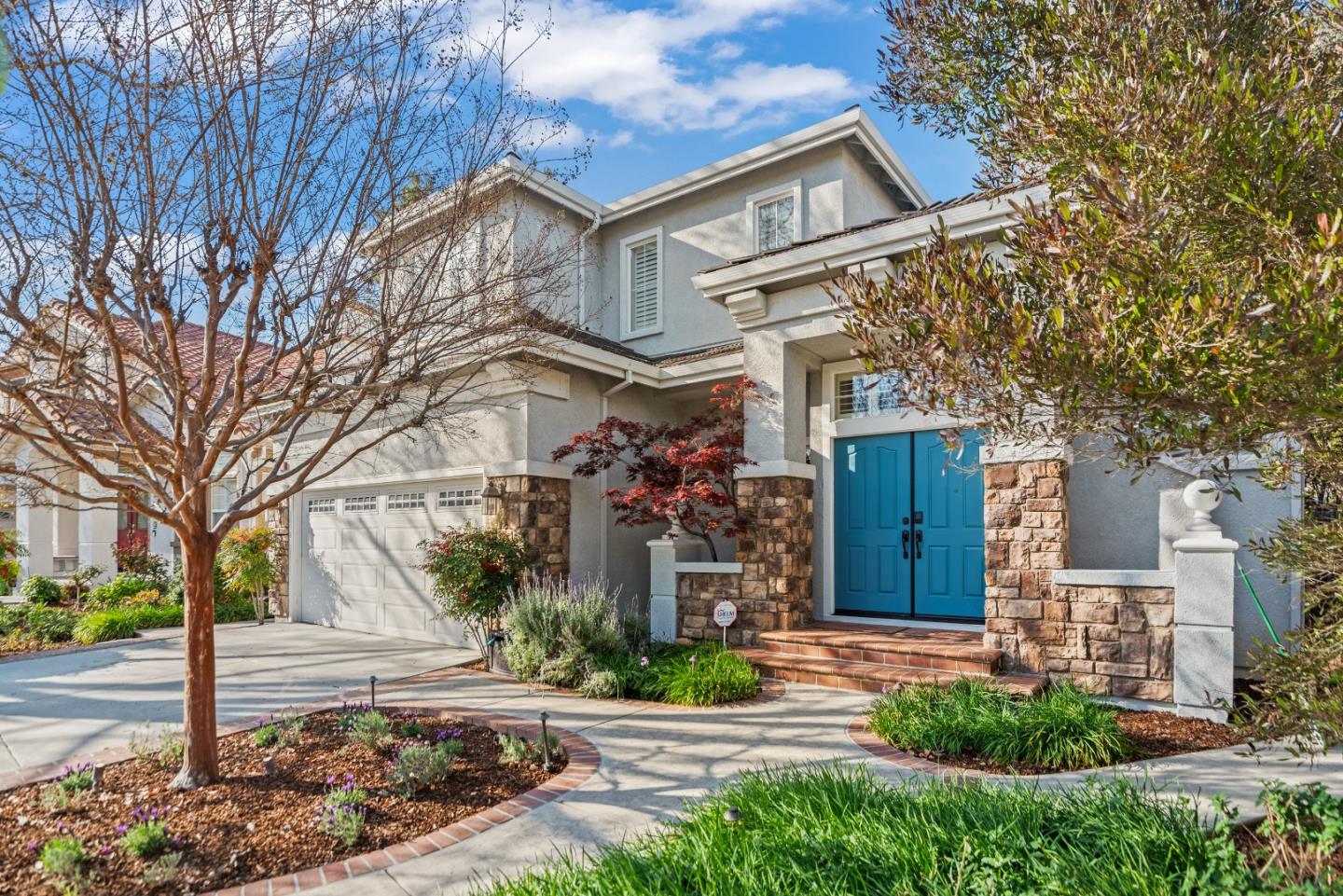 a front view of a house with garden