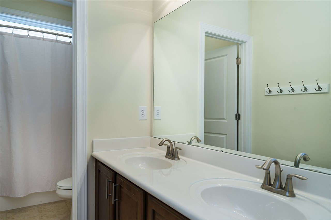 1334 Rodessa Run Raleigh, NC 27607 - Photo 19 of 25 BATHROOM UPSTAIRS WITH TWO SINKS AND LINEN CLOSET, PERFECT FOR SECONDARY BEDROOMS TO SHARE. BATHROOM
