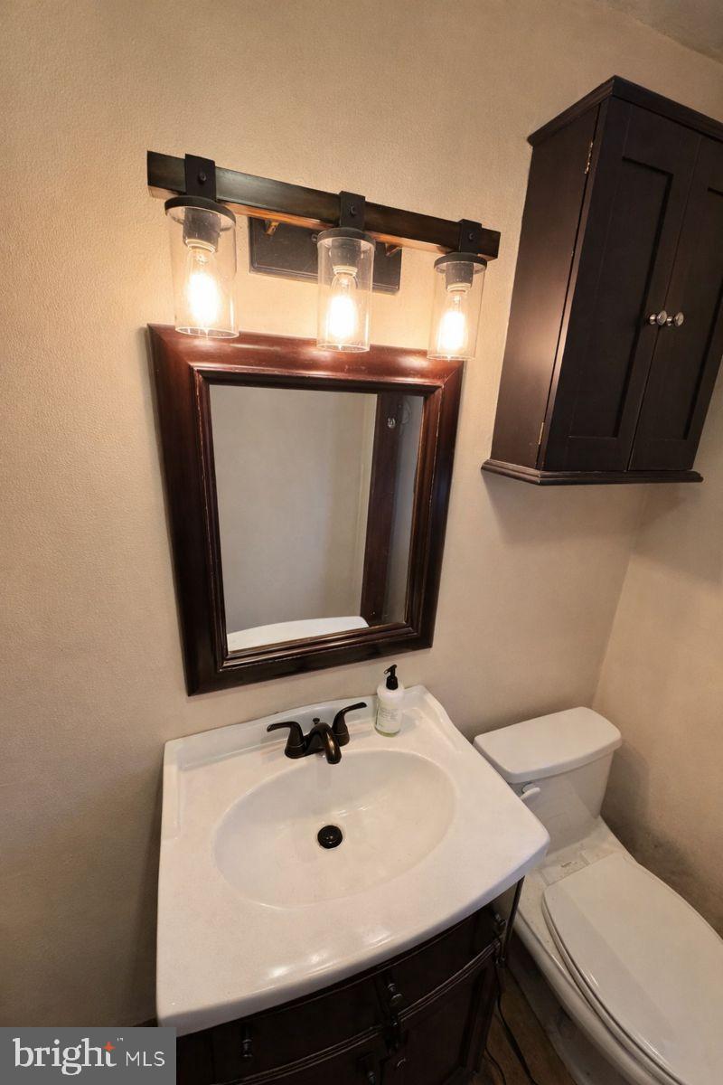 91 Mountain Road Rising Sun, MD 21911 - Photo 8 of 17 a bathroom with a toilet sink and mirror
