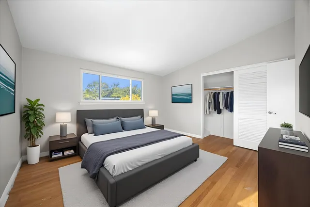 a bedroom with a large bed and a couch