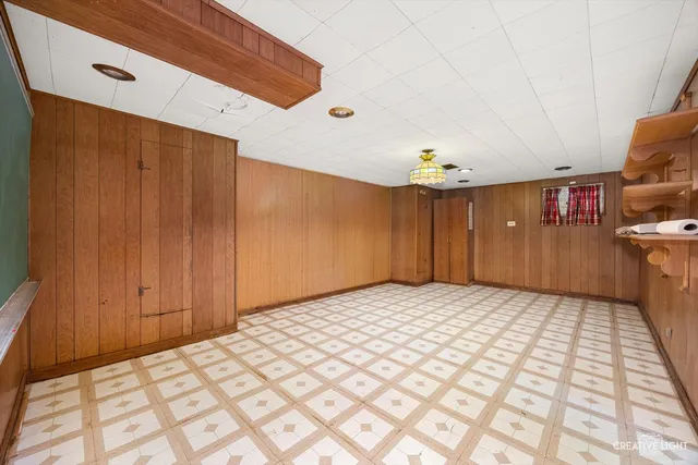 a bedroom with a bed and a book shelf