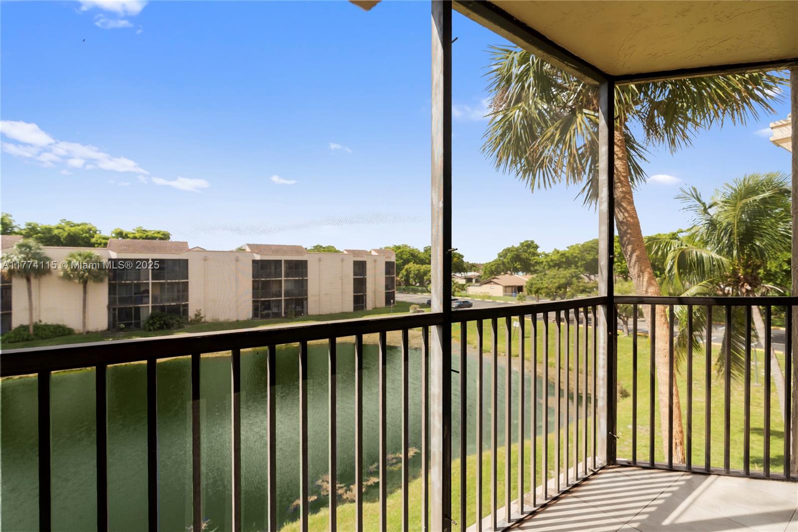 3199 Foxcroft Road, Unit 311 Miramar, FL 33025 - Photo 11 of 17 a view of a balcony with lake view