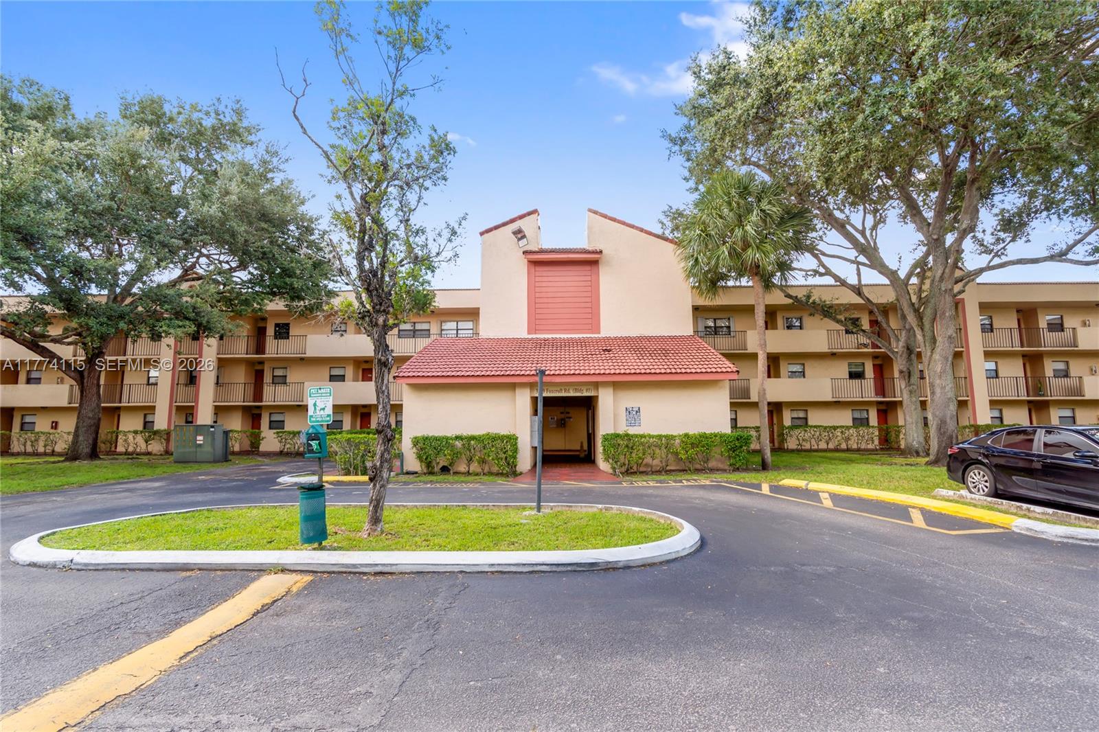 3199 Foxcroft Road, Unit 311 Miramar, FL 33025 - Photo 13 of 18 a view of a house with a swimming pool