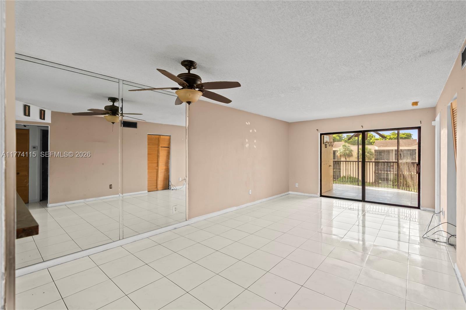 3199 Foxcroft Road, Unit 311 Miramar, FL 33025 - Photo 4 of 18 a view of an empty room with a window