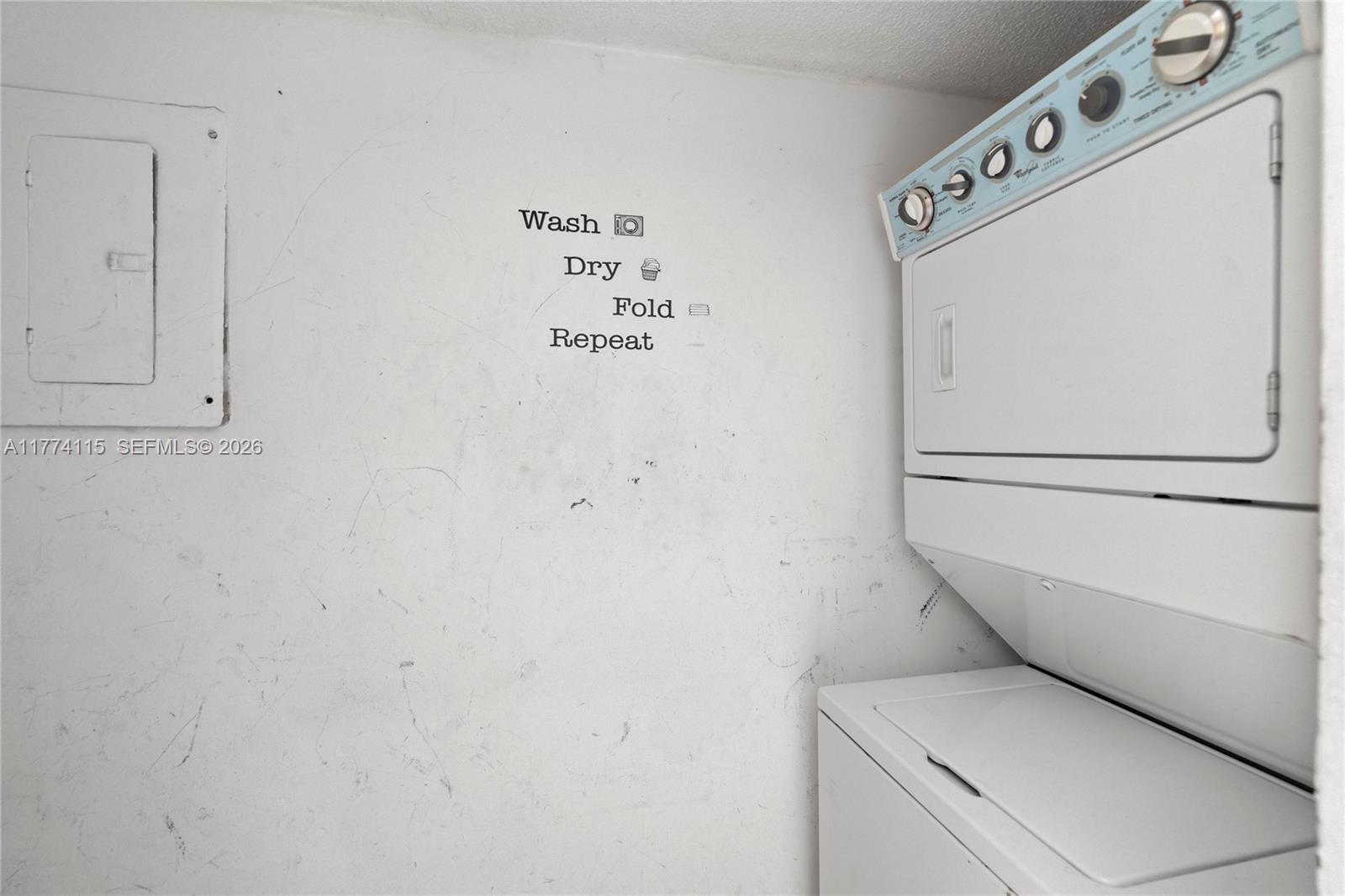 3199 Foxcroft Road, Unit 311 Miramar, FL 33025 - Photo 8 of 18 a utility room with dryer and washer