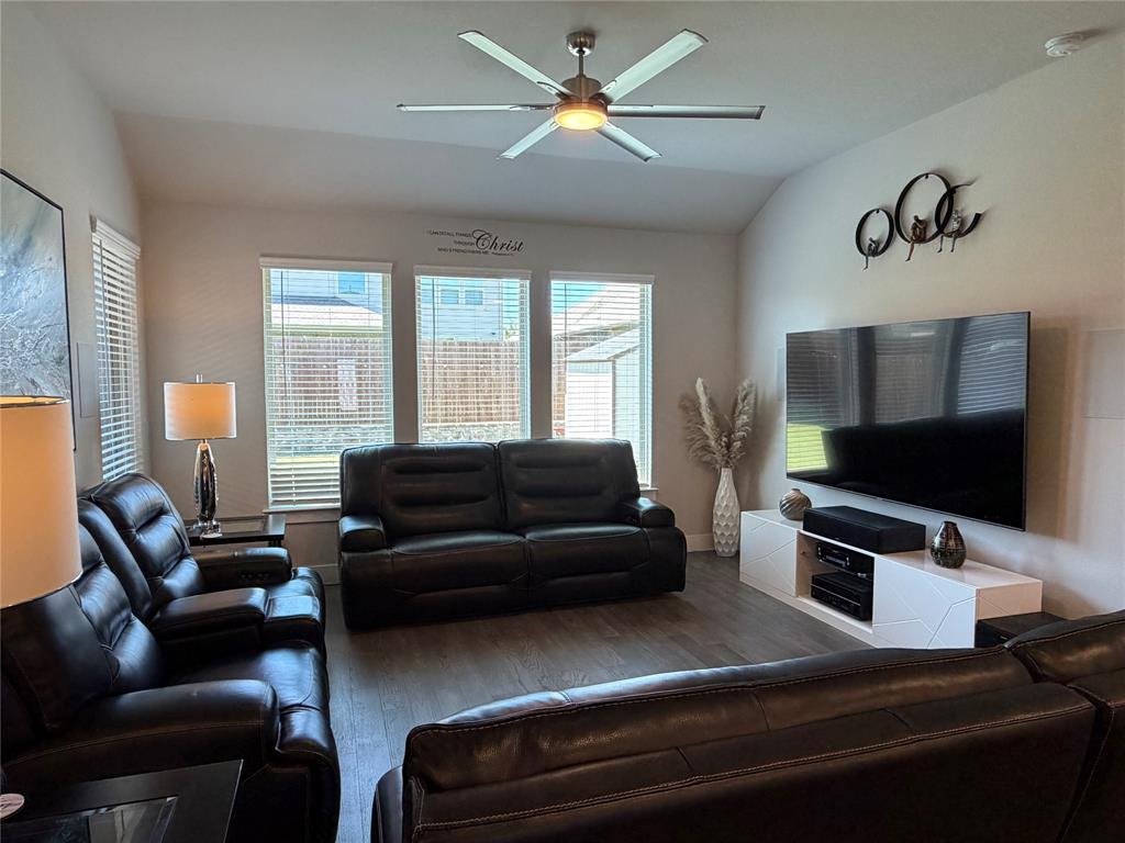 862 Mildren Lane Fate, TX 75087 - Photo 12 of 40 a living room with furniture and a flat screen tv