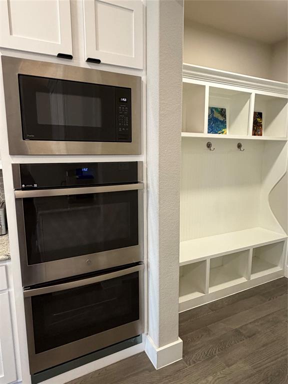 862 Mildren Lane Fate, TX 75087 - Photo 15 of 40 a stove top oven sitting inside of a kitchen