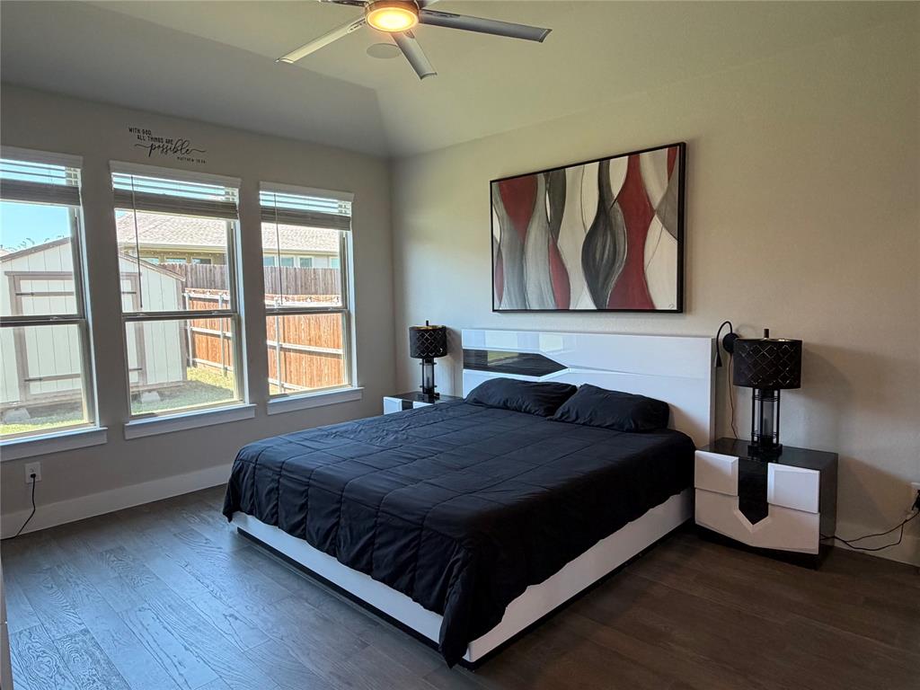 862 Mildren Lane Fate, TX 75087 - Photo 21 of 40 a bedroom with a bed and a window