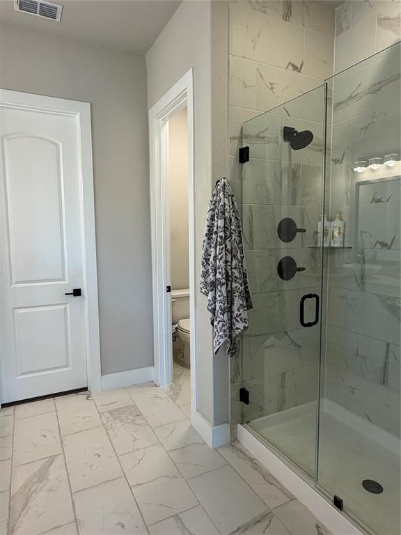 862 Mildren Lane Fate, TX 75087 - Photo 24 of 40 a bathroom with a shower and bathtub