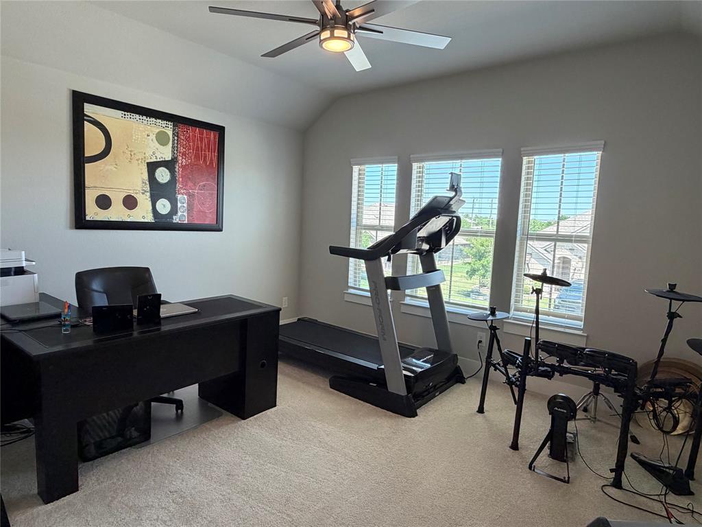 862 Mildren Lane Fate, TX 75087 - Photo 26 of 40 a view of a workspace with furniture and a window