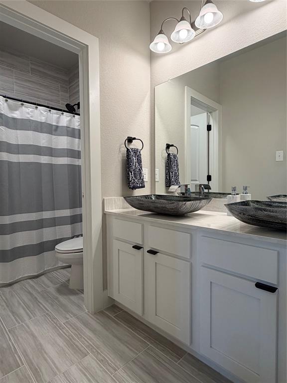 862 Mildren Lane Fate, TX 75087 - Photo 28 of 40 a bathroom with a sink and a mirror
