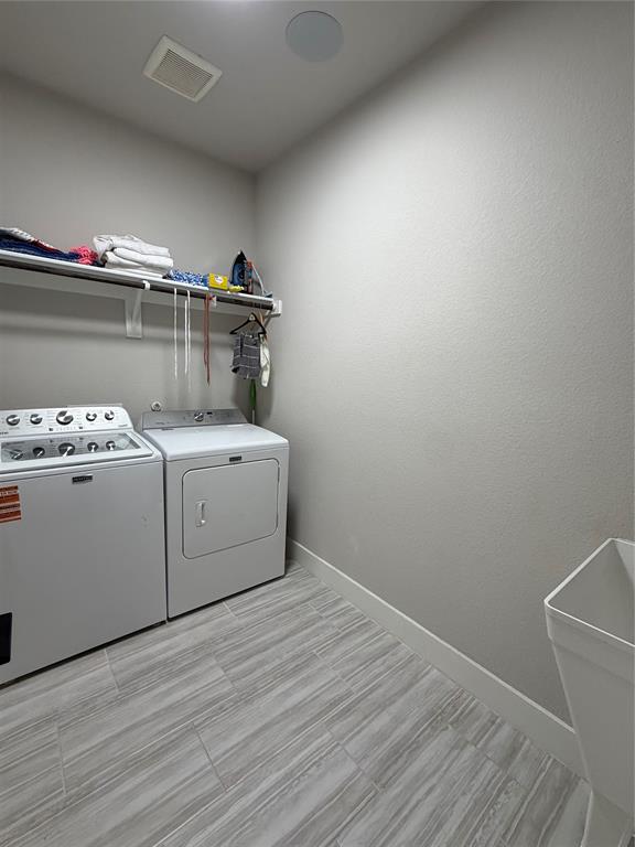 862 Mildren Lane Fate, TX 75087 - Photo 30 of 40 a utility room with washer and dryer