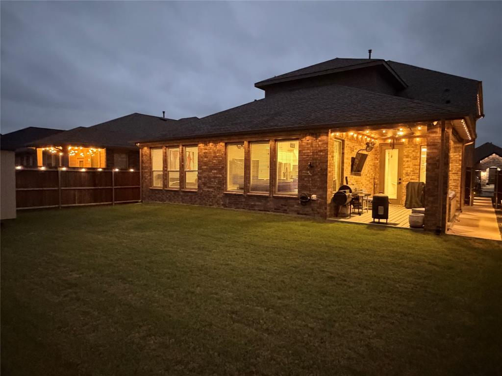 862 Mildren Lane Fate, TX 75087 - Photo 3 of 40 Comprehensive Lighting System that Illuminates the Covered Patio, Extended Deck, Fence and Entire Home Exterior Allowing Exciting Outdoor Entertainment.