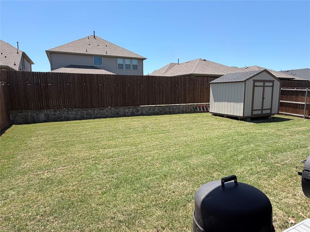 862 Mildren Lane Fate, TX 75087 - Photo 33 of 40 Large Yard with Storage Building