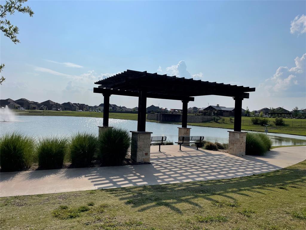862 Mildren Lane Fate, TX 75087 - Photo 36 of 40 Walking Path Around the Pound with Fountain. View of Pool in the Background.