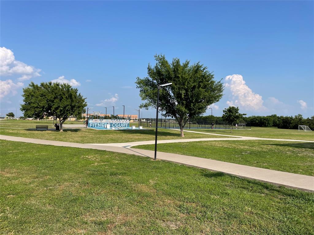 862 Mildren Lane Fate, TX 75087 - Photo 39 of 40 Fitness Court, Pickleball Court and Soccer Field. Trees in the Background Border Frisbee Golf Course. Great Walking Trails Throughout!