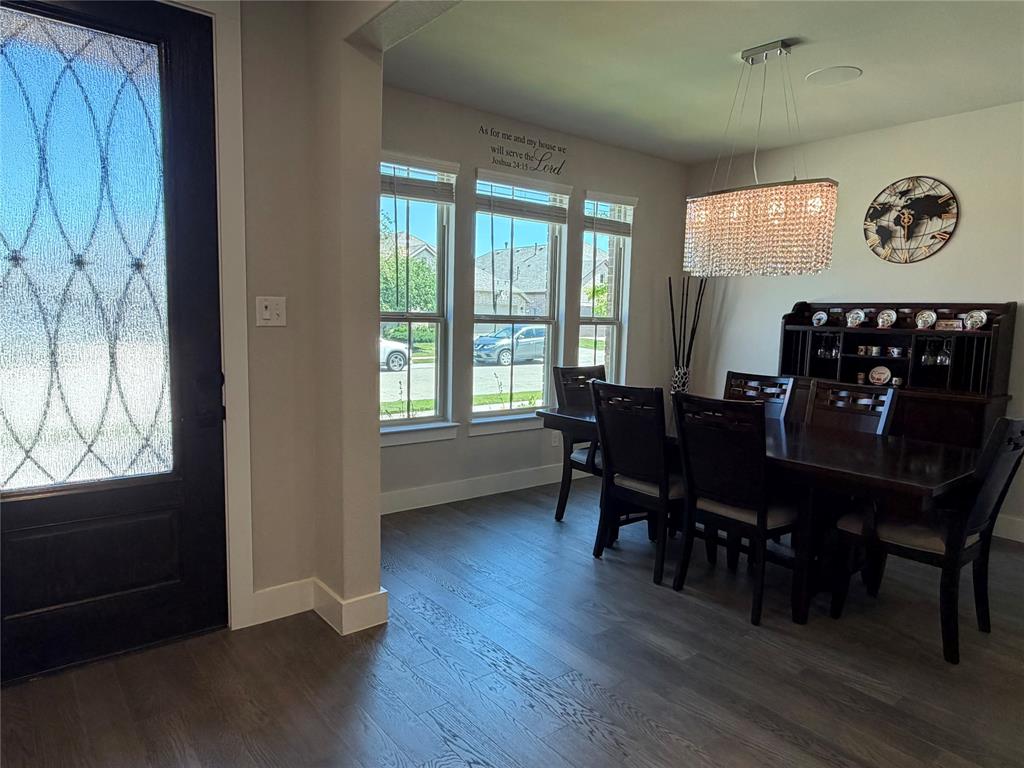 862 Mildren Lane Fate, TX 75087 - Photo 5 of 40 a view of a dining room with furniture and wooden floor