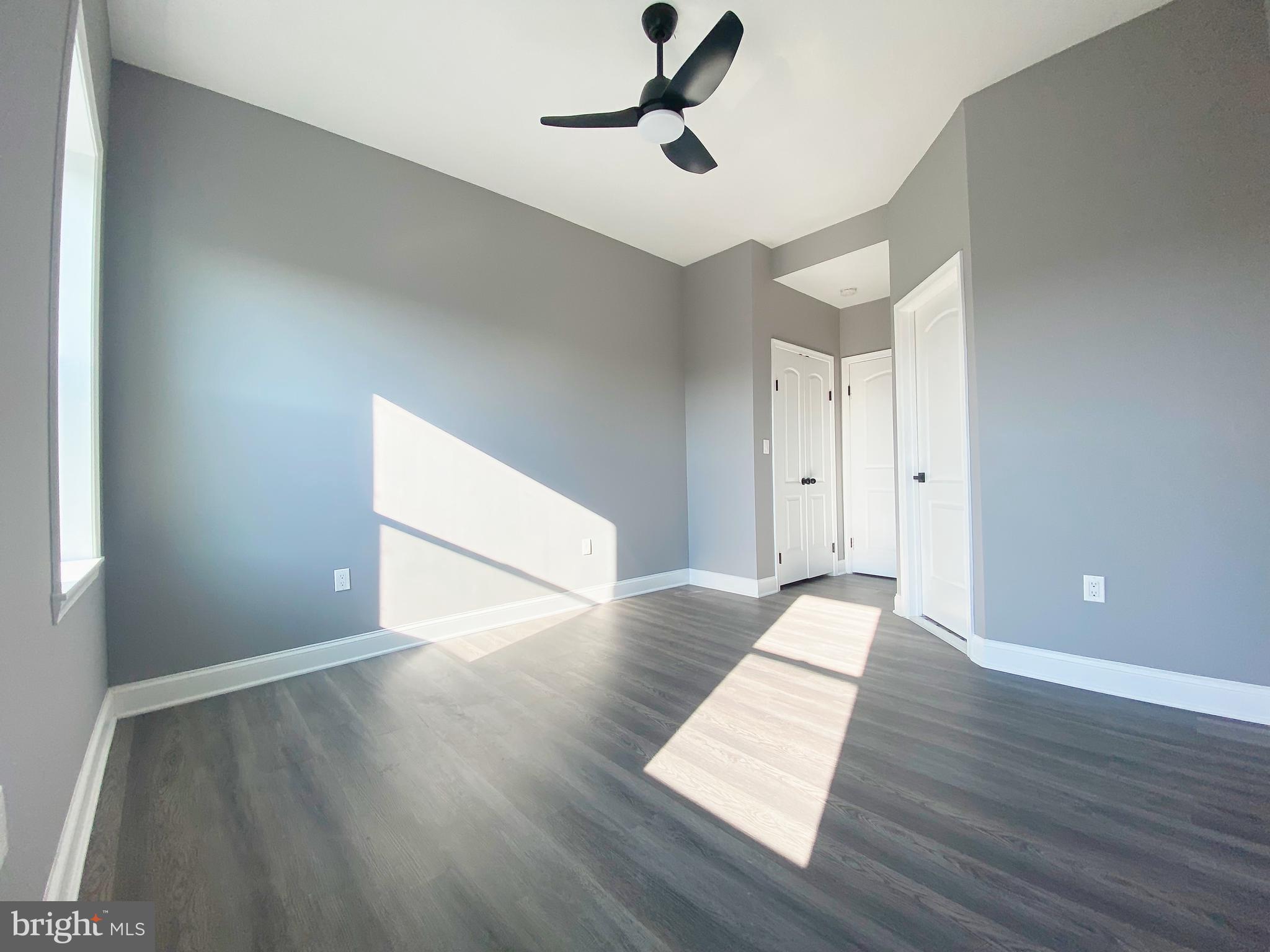 1604 Cliftview Avenue Baltimore, MD 21213 - Photo 17 of 34 a view of an empty room with wooden floor
