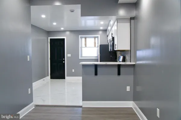 a kitchen with kitchen island sink and faucet