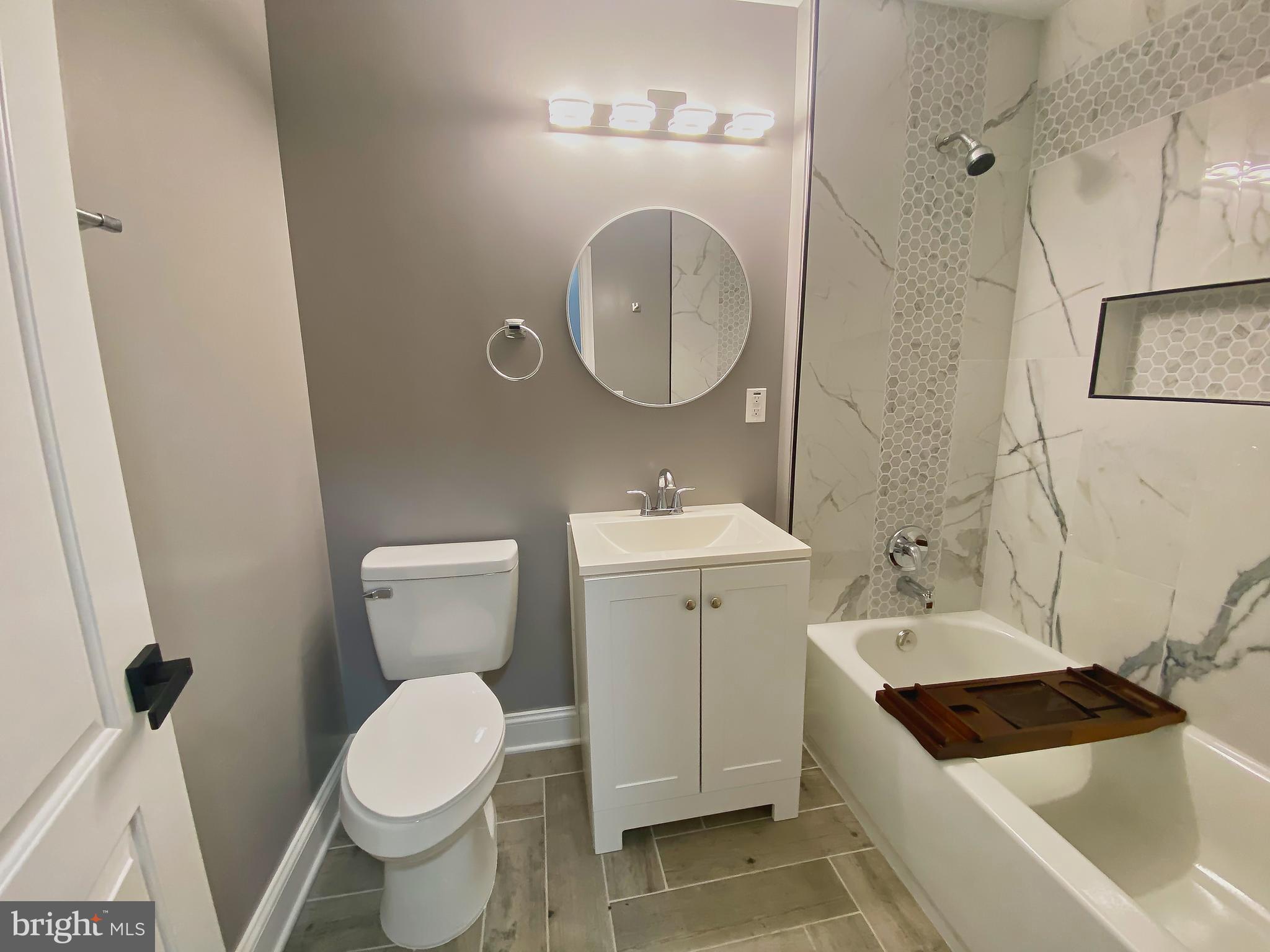 1604 Cliftview Avenue Baltimore, MD 21213 - Photo 21 of 34 a bathroom with a sink and a mirror