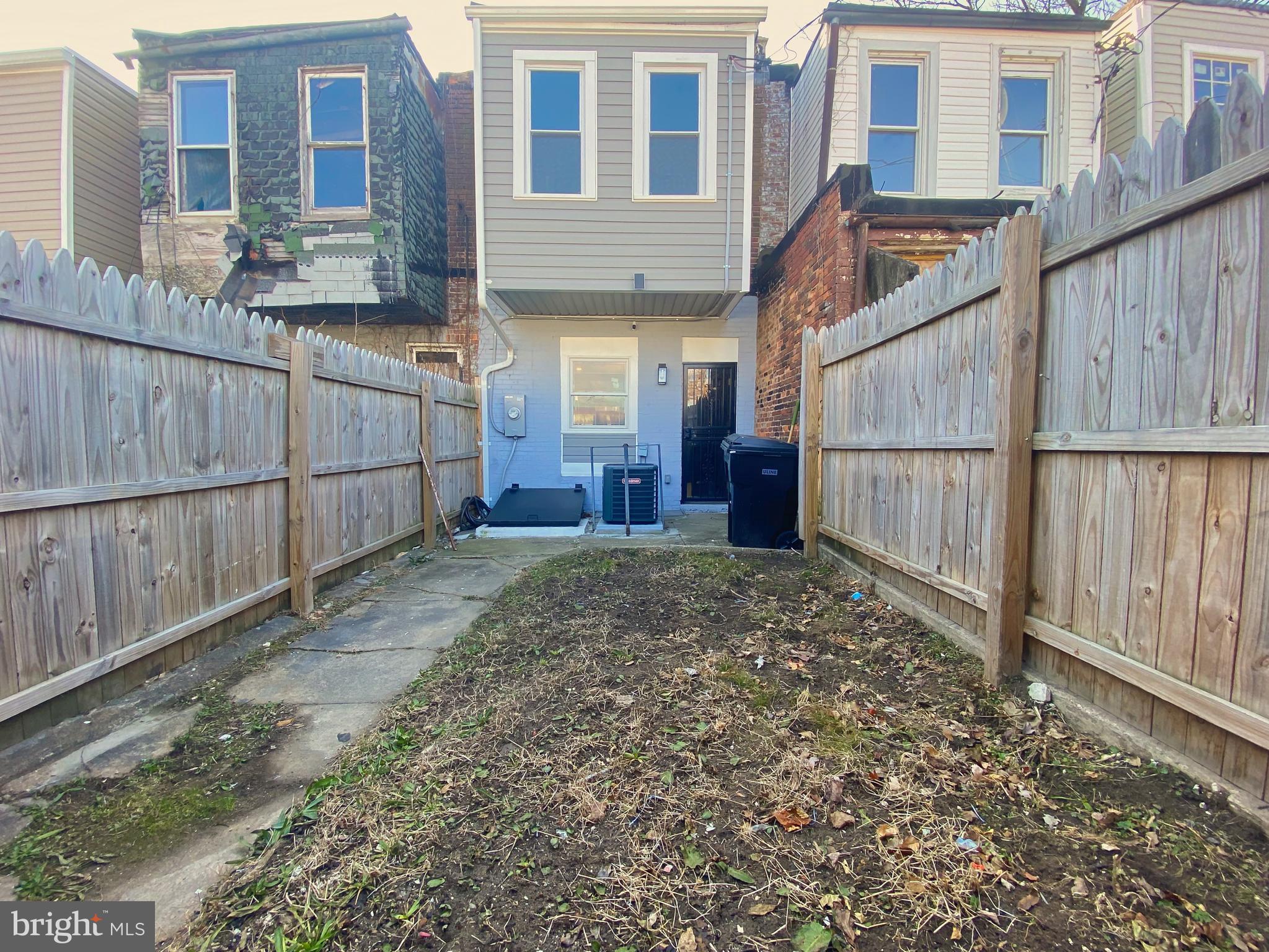 1604 Cliftview Avenue Baltimore, MD 21213 - Photo 32 of 34 a view of a house with wooden fence