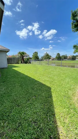 a view of an ocean and a yard