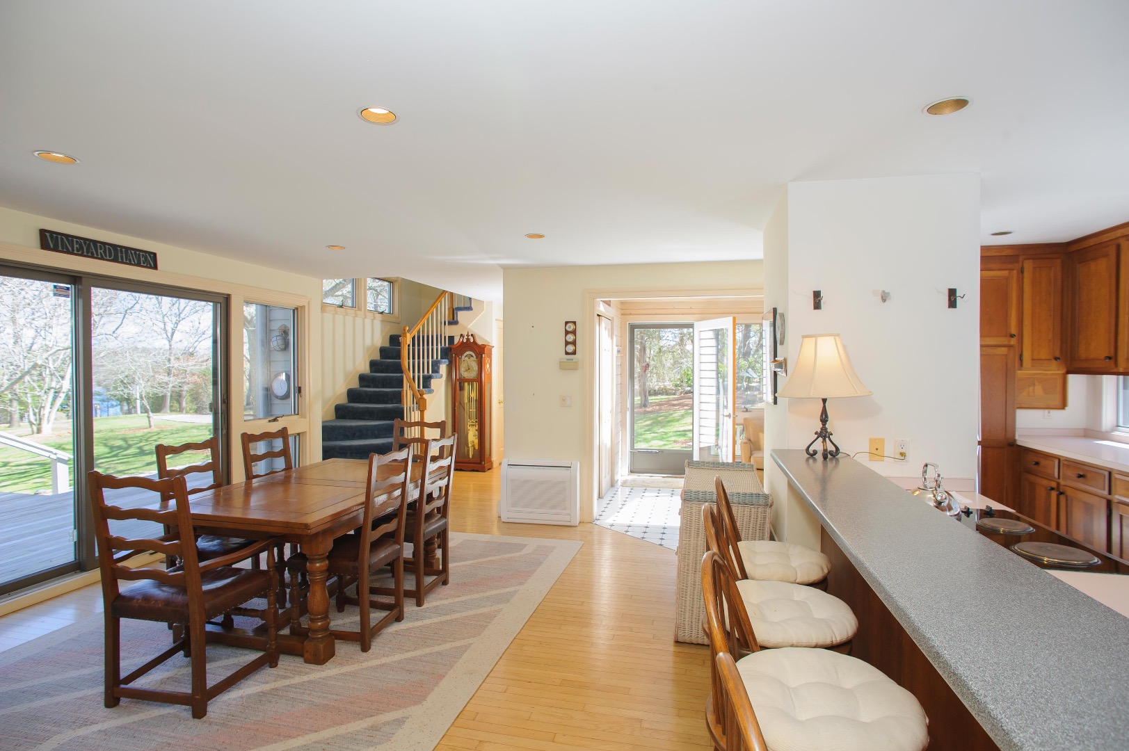 237 Lagoon Pond Road Vineyard Haven, MA 02568 - Photo 10 of 21 a living room with furniture a large window and a dining table