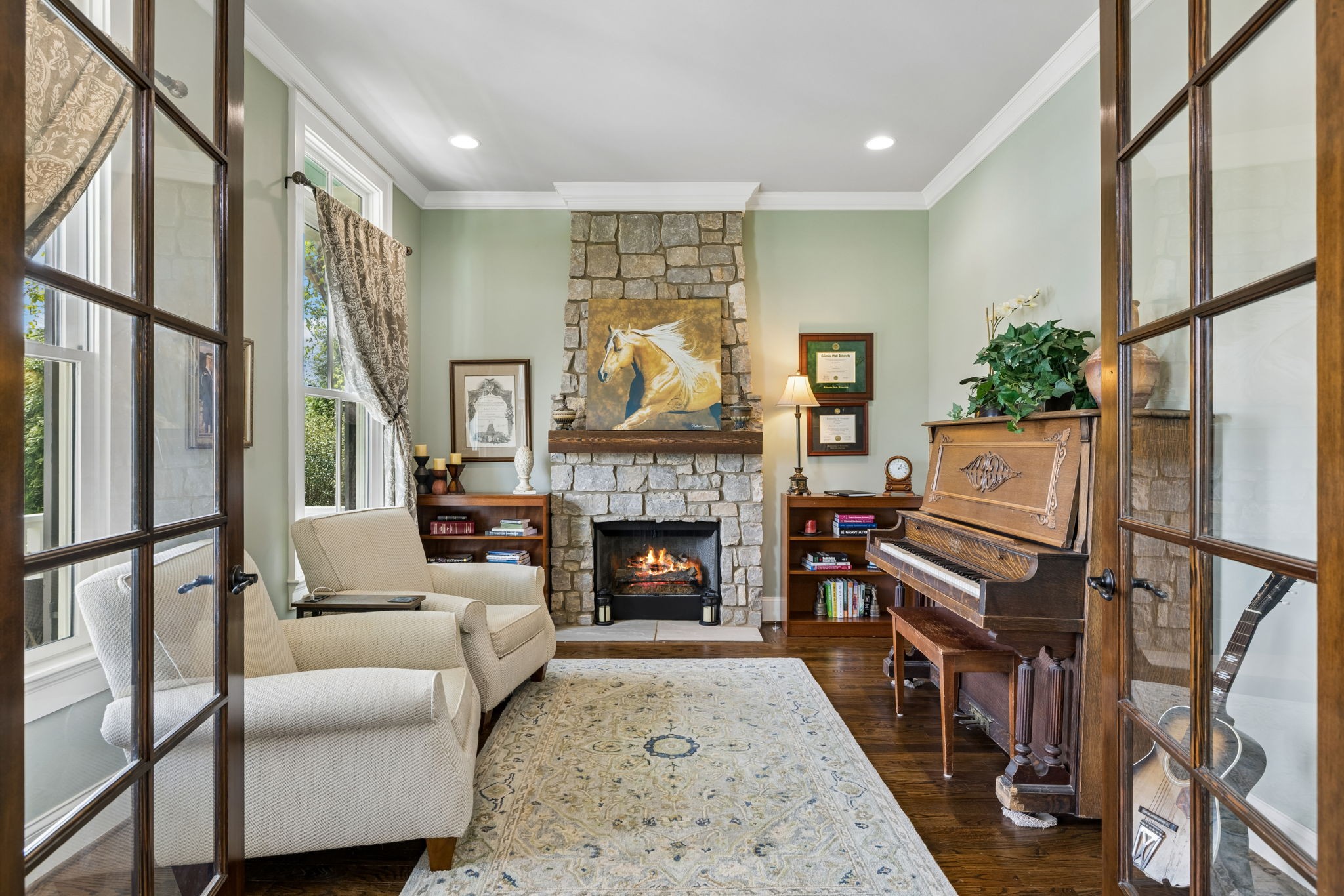 6033 Native Pony Trail College Grove, TN 37046 - Photo 12 of 87 a living room with furniture a fireplace and a large window