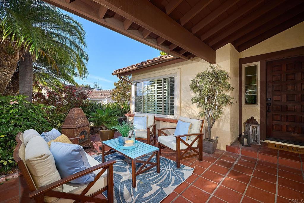 1323 Calle Scott Encinitas, CA 92024 - Photo 2 of 28 a view of a patio with table and chairs and potted plants