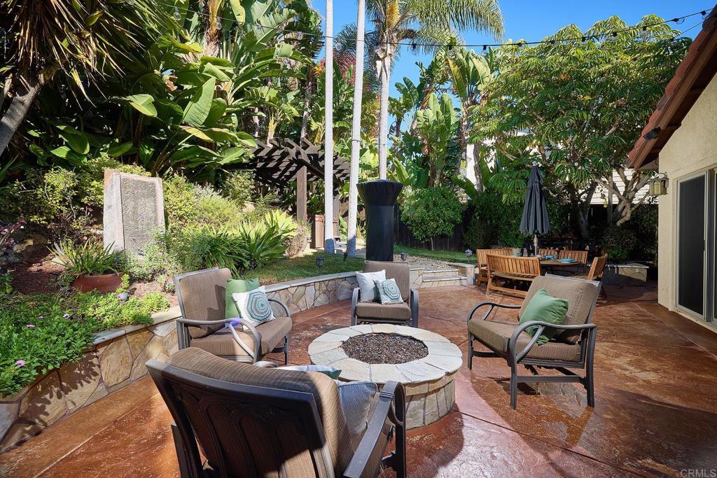 1323 Calle Scott Encinitas, CA 92024 - Photo 23 of 28 a view of a patio with table and chairs and potted plants
