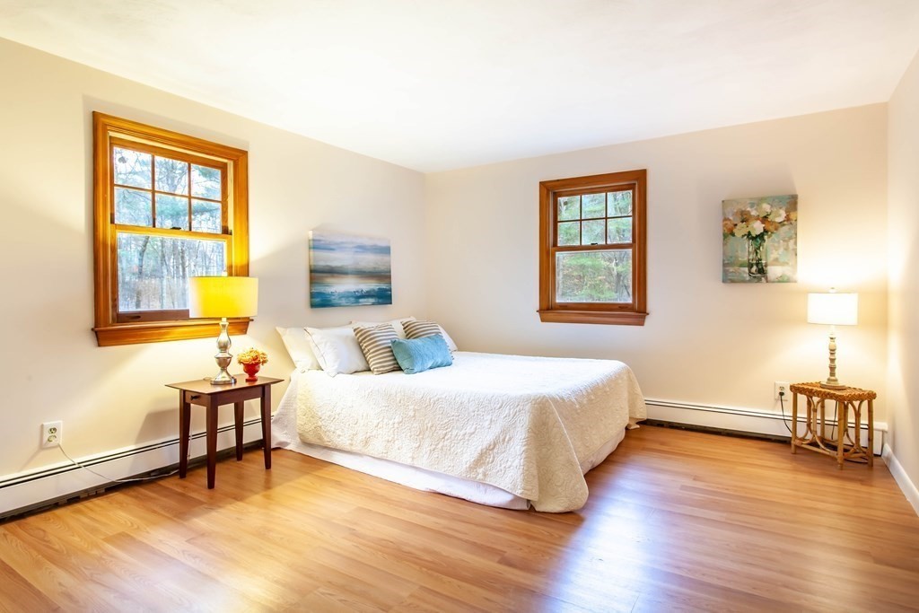 420 Great Road, Unit C2 Acton, MA 01720 - Photo 11 of 20 a bedroom with a bed and wooden floor