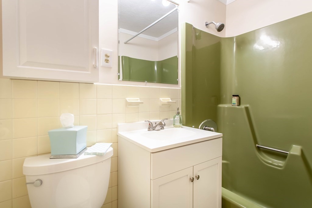 420 Great Road, Unit C2 Acton, MA 01720 - Photo 15 of 20 a bathroom with a sink a toilet and mirror