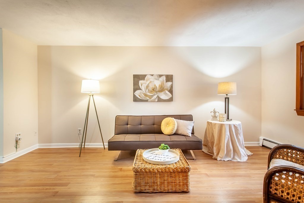 420 Great Road, Unit C2 Acton, MA 01720 - Photo 4 of 20 a living room with furniture and a lamp
