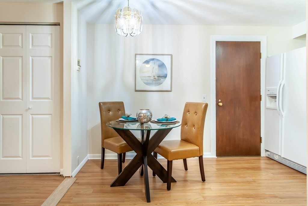 420 Great Road, Unit C2 Acton, MA 01720 - Photo 8 of 20 a view of a dining room with furniture and wooden floor