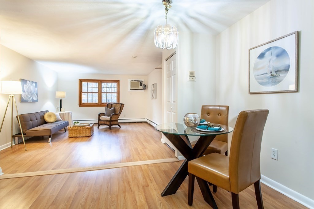 420 Great Road, Unit C2 Acton, MA 01720 - Photo 10 of 20 a living room with furniture and a wooden floor