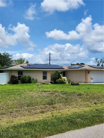 front view of a house with a yard