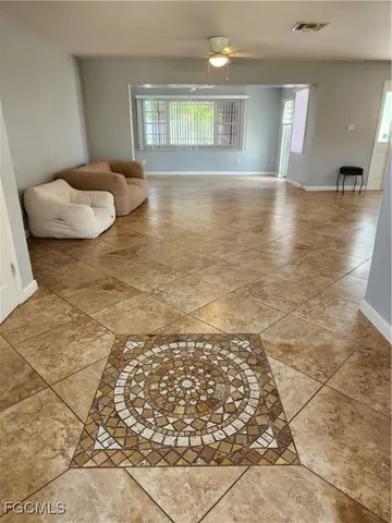 a view of a living room and kitchen