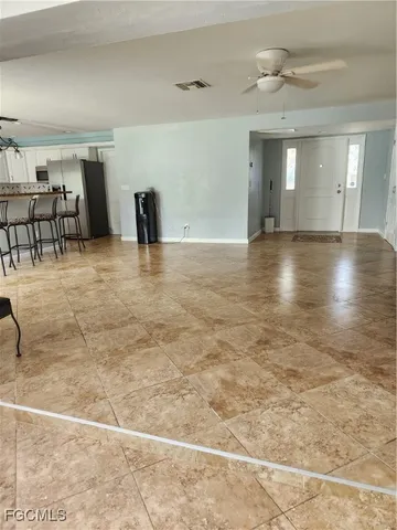 a view of an empty room and window