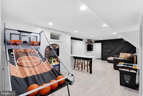 a bedroom with furniture and wooden floor