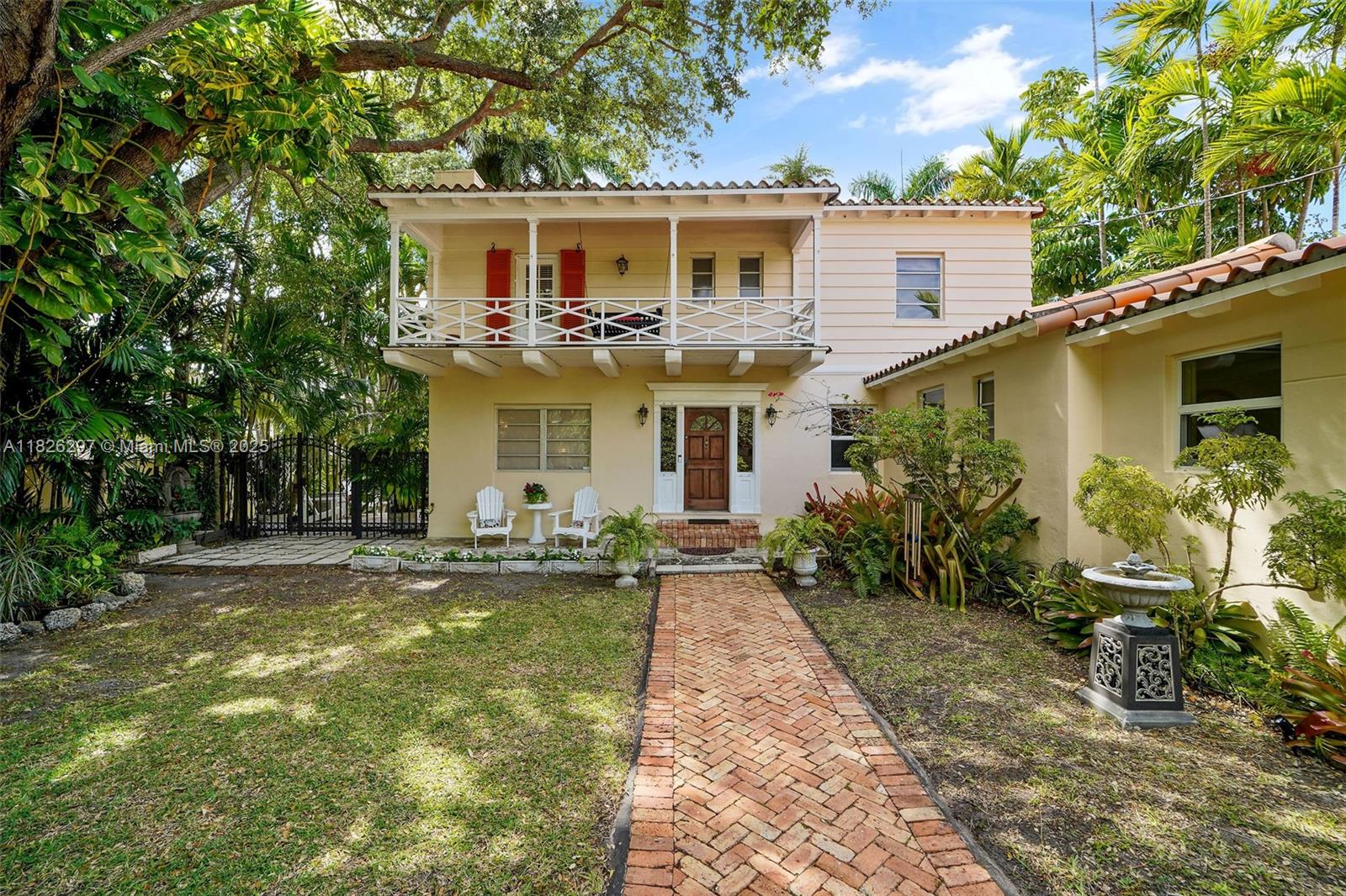 5842 Alton Road Miami Beach, FL 33140 - Photo 1 of 1 a view of a house with backyard sitting area and garden