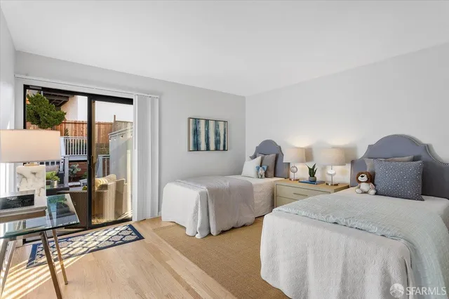 a balcony with furniture and a potted plant