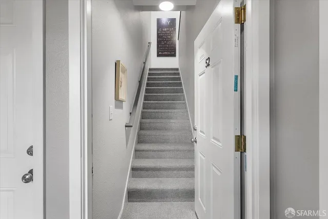 a view of a hallway with stairs