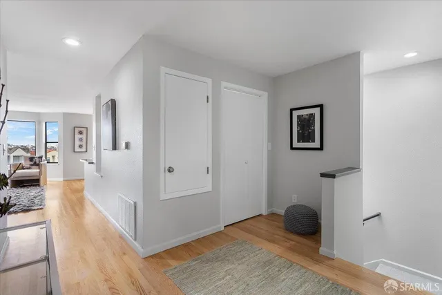 a view of a hallway with washer and dryer